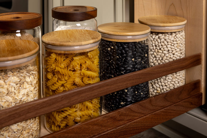 9" Walnut Creek Pullout Canister Organizer with Knife Block installed in a kitchen cabinet